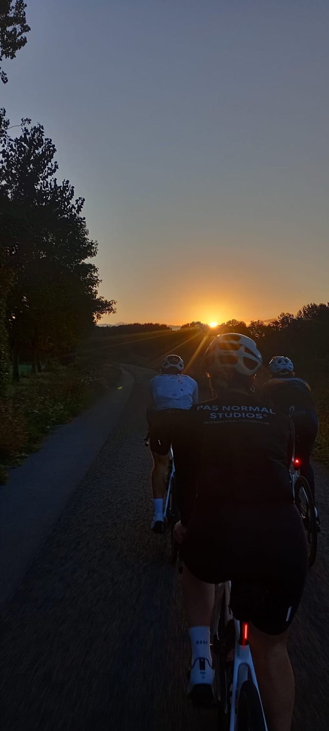 Riders silhouetted against the setting sun